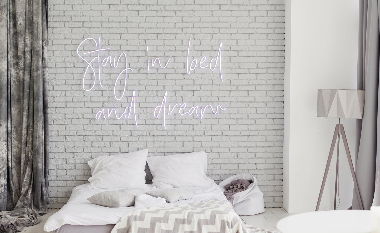 Dreamland Awaits: Stay in Bed with Neon Sign